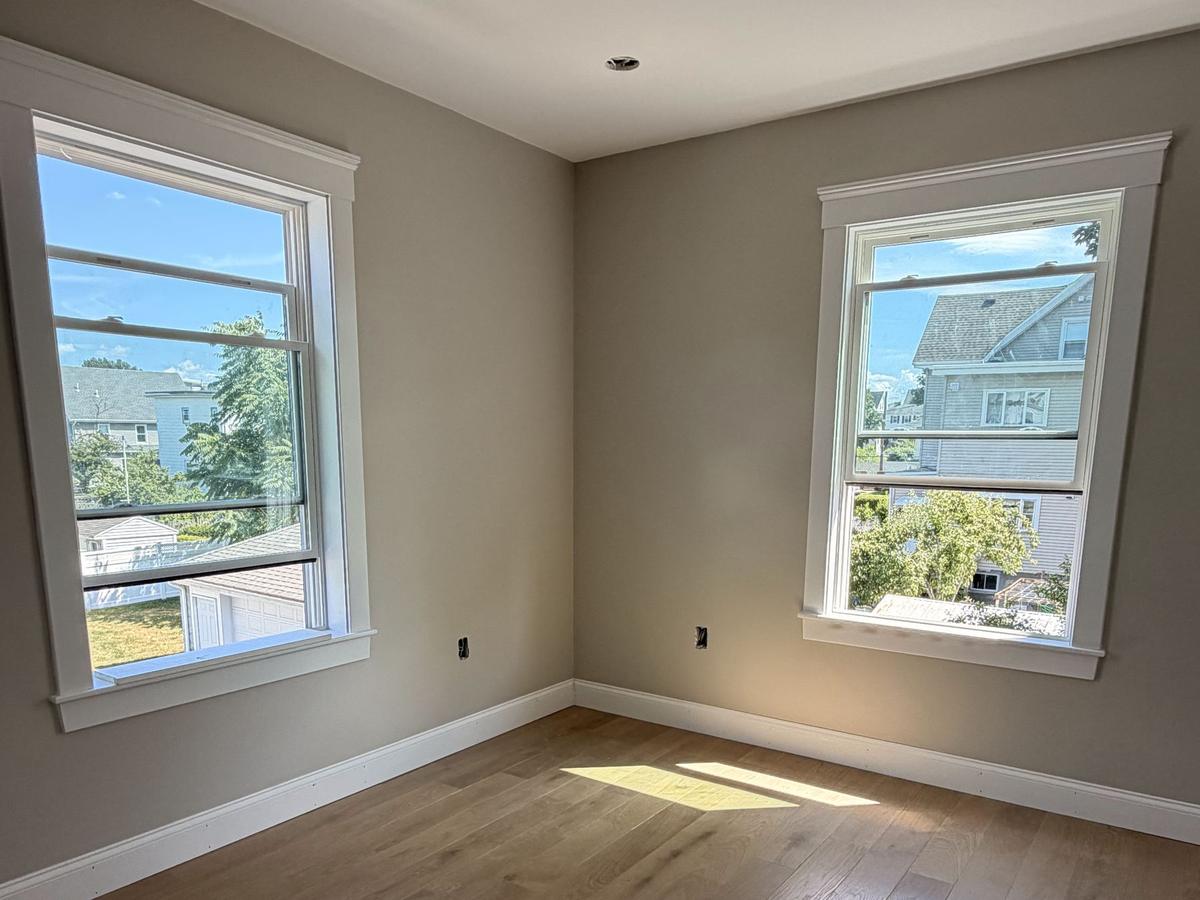 Window casings and baseboards in a finished bedroom
